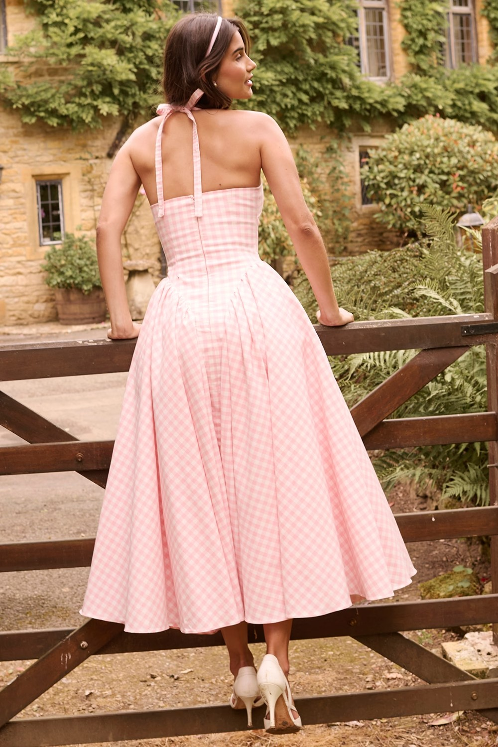 Fieno Strawberry Retro Rosette Midi Dress in pink gingham with halter neckline and flowy midi skirt, perfect for parties, weddings, and casual outings